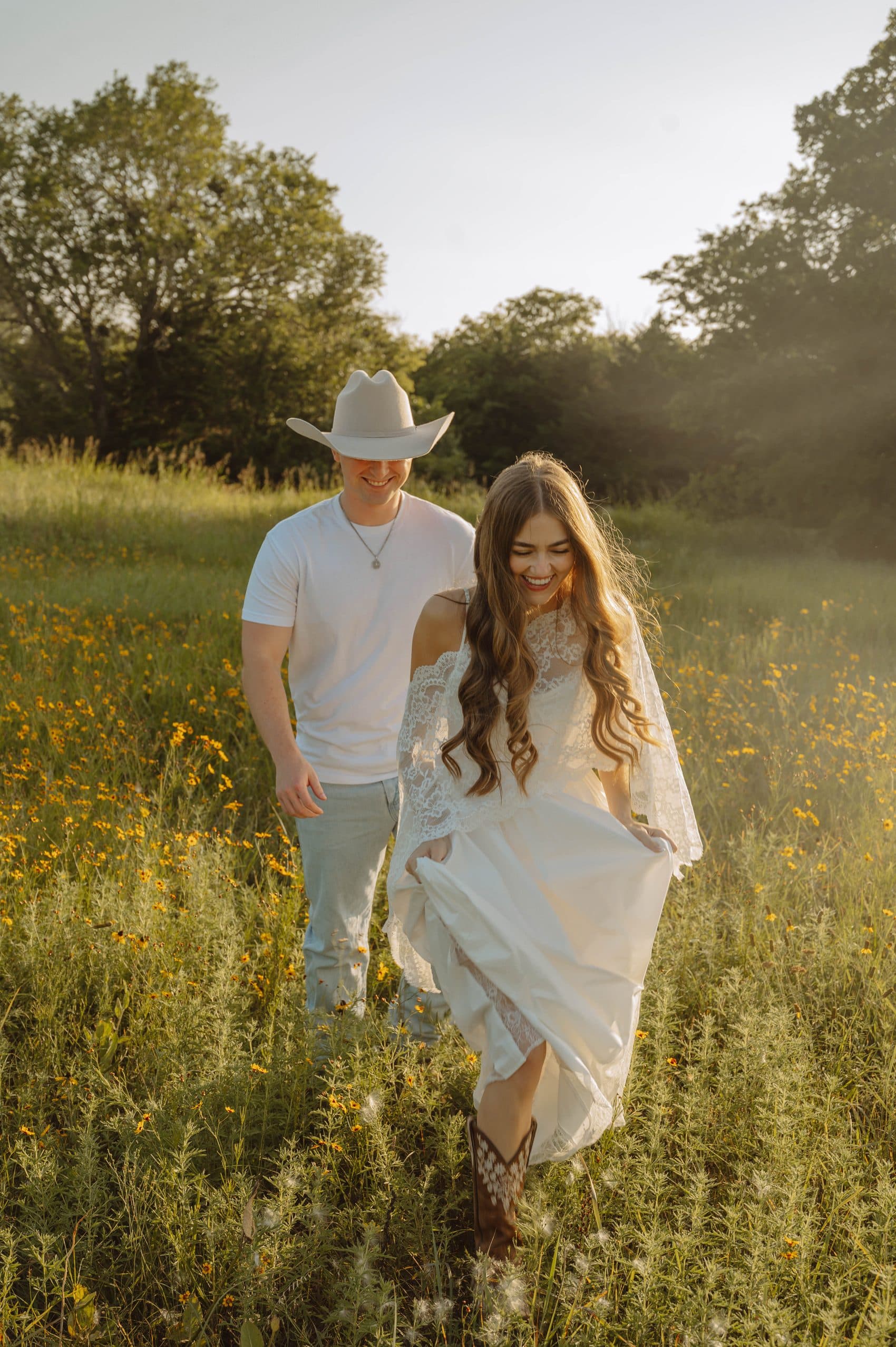 Elise laughing, holding her dress, walking toward Tyler in the evening light