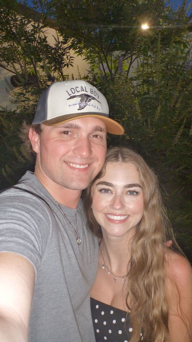 Elise and Tyler taking a selfie outside after dinner