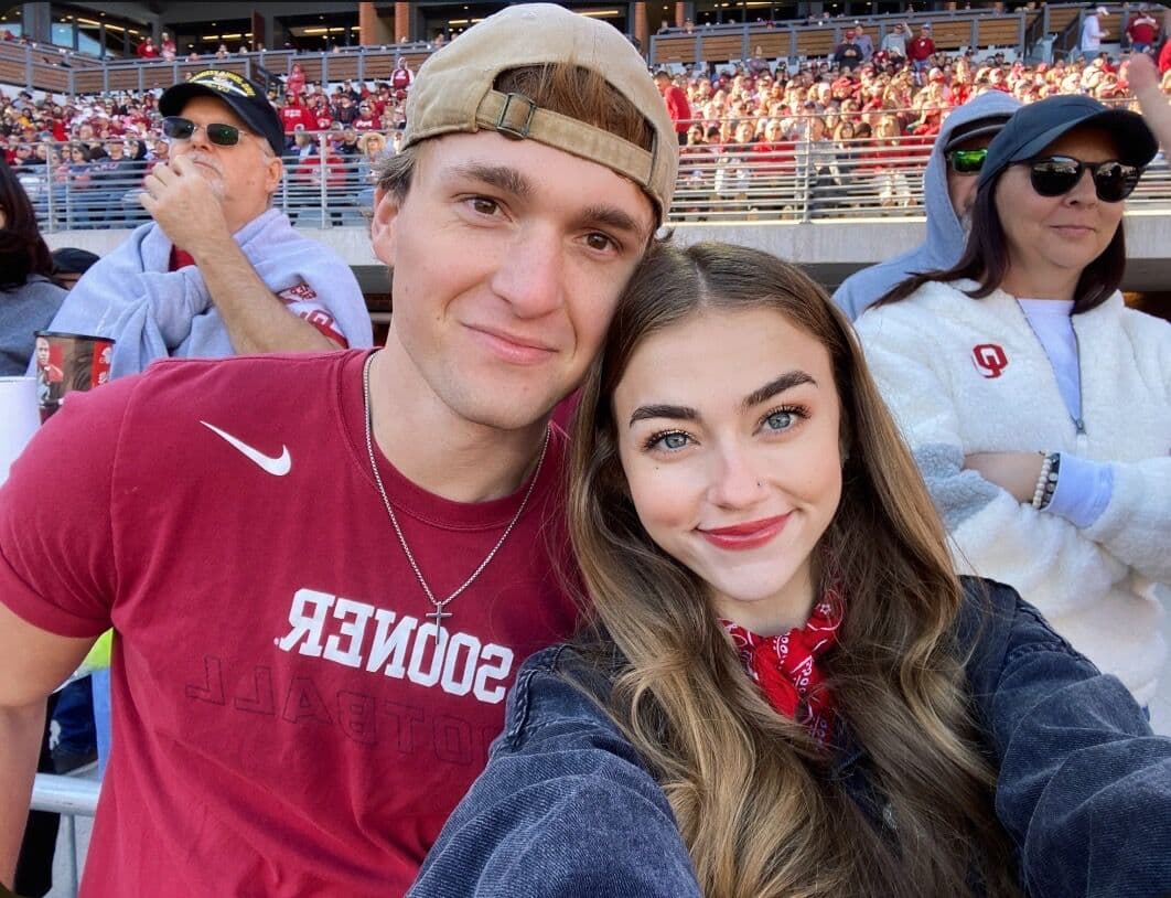 Elise and Tyler in the stands at an Oklahoma football game