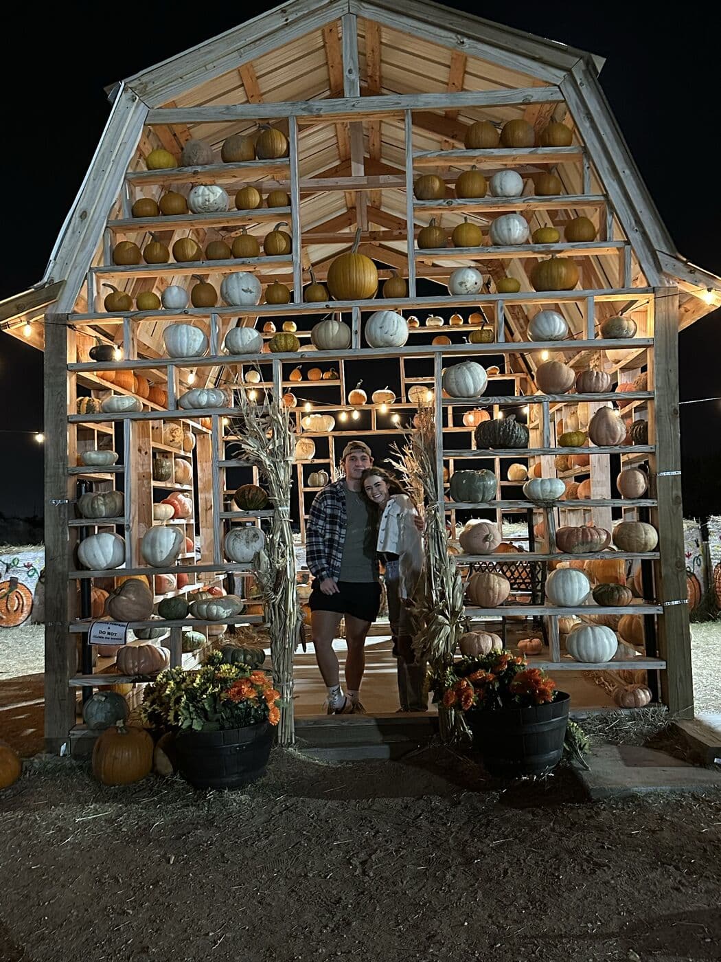 The lit pumpkin barn at Orr Family Farm after dark