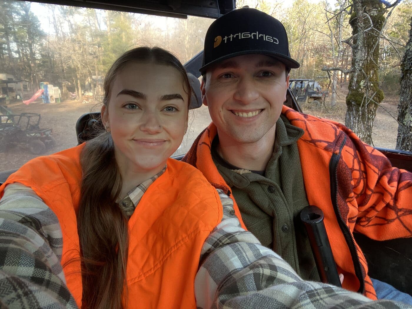Elise and Tyler in blaze orange on the trail that morning